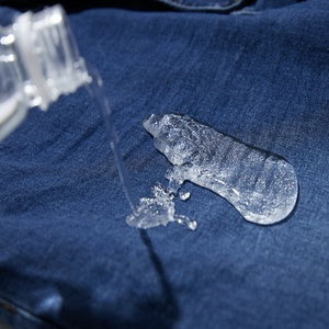 Waterproof motorcycle denim jeans with hydrophobic surface and water droplets display