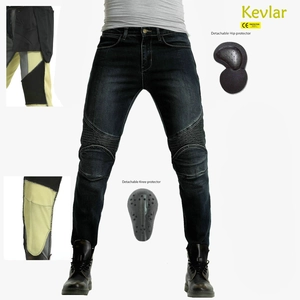 Detail of Kevlar lining and removable CE protectors on blue motorcycle riding jeans