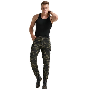 Detail of cargo multi-pockets on camouflage motorcycle riding pants with rugged texture