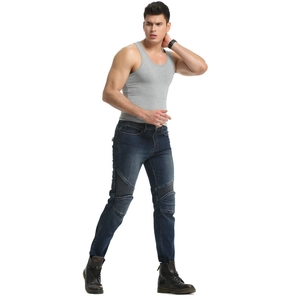 Close-up of motorcycling denim pants featuring ribbed stretch panels at the knees