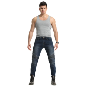 Detail of motorcycle jeans with protective knee pleats and stretch denim texture