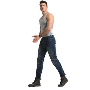 Detail of blue biker jeans featuring reinforced accordion pleats at the knees for men