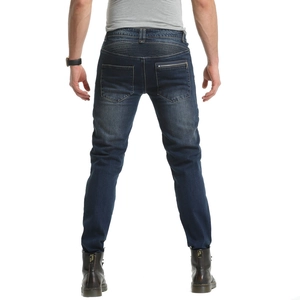 Detail of blue biker jeans featuring reinforced back pleats and secure zip pocket design
