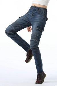 Detail of blue moto jeans with pleated knee panels and side cargo pockets for motorcycle riding