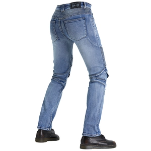 Detail of vintage motorcycle jeans with stretch ribbing on waist and brand leather patch