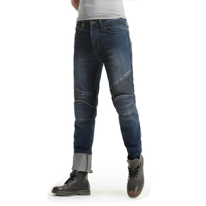 Detail of blue denim motorcycle jeans featuring protective knee pleats and slim fit style
