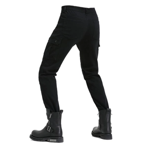 Men's motorcycle cargo pants in black with protective CE gear and riding boots