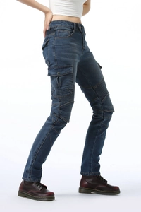 Detail of dark blue motorcycle cargo jeans featuring protective accordion panels on knees