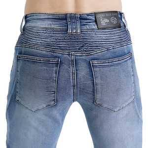 Close-up of motorcycle jeans with accordion stretch panels and brand leather patch