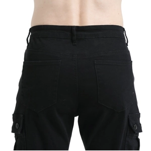 Detail view of black motorcycle cargo pants featuring rear pockets and tactical belt loops
