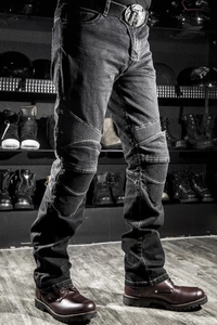 Slim-fit motorcycle denim pants featuring stretch accordion panels and heavy-wash texture