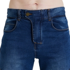 Detail of metal button closure and pocket on dark blue motorcycle denim jeans