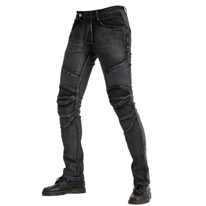 Close-up of flexible accordion panels on dark grey denim motorcycle riding jeans