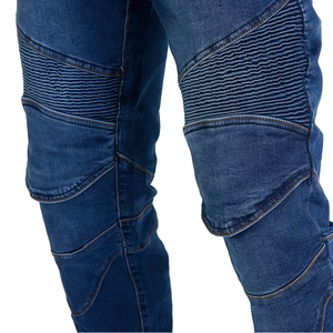 Detail of motorcycle jeans showing knee pleated accordion panels in dark blue denim