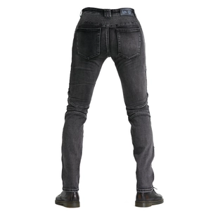 Macro detail of elastic accordion stretch panels on black motorcycling jeans for men