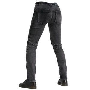 Detail view of stretch accordion panels on the waist and knees of black motorcycling jeans