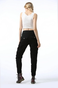 Rear view of black slim-fit motorcycle cargo pants with multi-pockets and protective gear