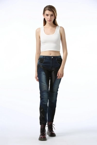 Detail of blue motorcycle jeans featuring leather panels and protective knee pleats