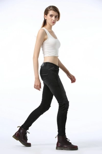 Side view of black motorcycle riding jeans for women with pleated panels and slim fit