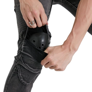 Detail of motorcycle jeans showing accordion stretch panels and removable knee protectors