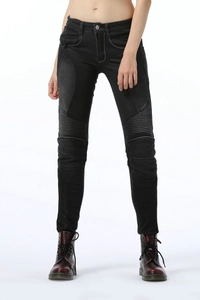 Detail of motorcycle pants featuring pleated knee stretch panels and multi-material stitching