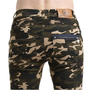Detail of camouflage motorcycle jeans featuring elastic accordion panels and leather logo patch