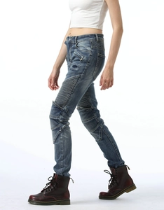 Detail view of cotton biker jeans featuring ribbed knee panels and slim fit denim