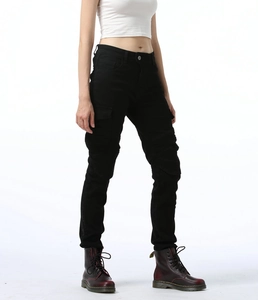 Close-up of black cargo motorcycle pants with side pockets and pleated knee details