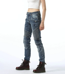 Detail of ribbed moto panels and zipper pocket on dark blue women's biker jeans
