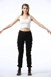 Close-up of black women's motorcycle cargo pants with multi-pocket and pleated knee details