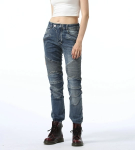 Detail of vintage blue cotton motorcycle jeans featuring elastic pleated panels on knees