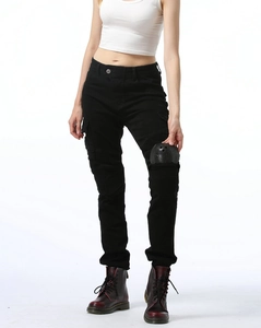 Detail view of black motorcycle pants showing the knee protectors and ribbed design