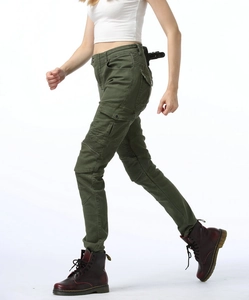 Detail of army green tactical cargo pants showing reinforced knees and utility side pockets