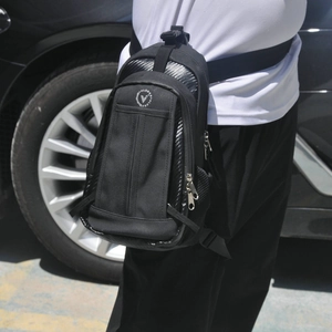 Detail of waterproof motorcycle leg bag showing durable black fabric and secure buckles