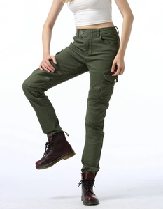 Detail view of olive green motorcycle pants with ribbed knee panels and cargo pockets