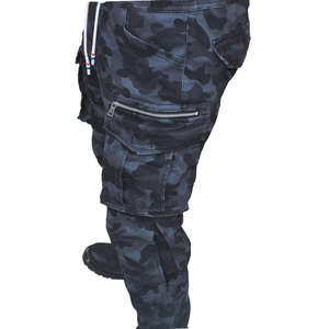 Detail of dark grey camo motorcycle cargo pants with large side pockets and metal zippers