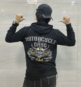 Detail view of motorcycle gang graphic print on back of black hoodie for men