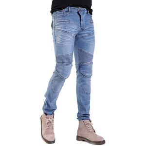 Close-up of light blue biker motorcycle jeans with ribbed knee pleats and slim fit