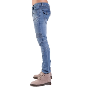 Detail of light blue motorcycle jeans with accordion knee pleats and side cargo pockets