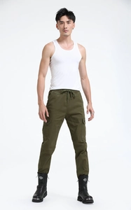 Detail of army green cargo pants with drawstring waist and large side flap pockets