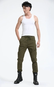 Detail showing elastic drawstring waistband and durable olive green cotton fabric texture