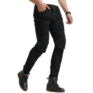 Detail of slim-fit motorcycle jeans with orange stitching and accordion stretch panels