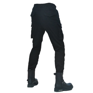 Detail of black tactical motorcycle cargo pants with elastic waist and multiple pockets