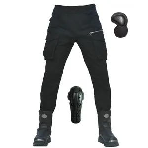 Detail of motorcycle cargo pants with detachable knee and hip protectors in black