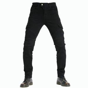 Detail view of motorcycle cargo pants featuring accordion stretch panels and tactical side pocket