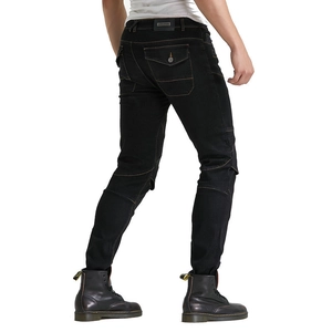 Macro detail of motorcycle jeans with protective accordion panels and slim fit design