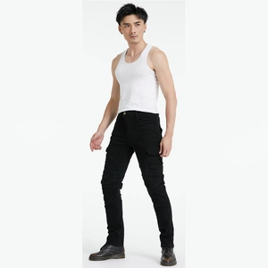 Detail of cargo motorcycle pants featuring pleated knee panels and large utility side pockets