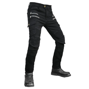 Detail of black motorcycle tactical pants featuring multiple zippers and cargo pockets