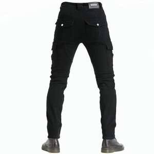 Detail of black tactical motorcycle pants with elastic knee panels and utility pockets