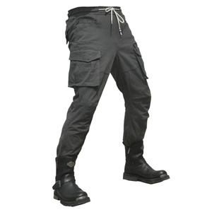 Detail of dark grey motorcycle cargo pants with large side pockets and drawstring waist